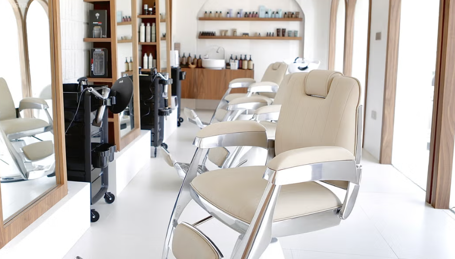 Calma salon with cream barber chairs and arched mirrors