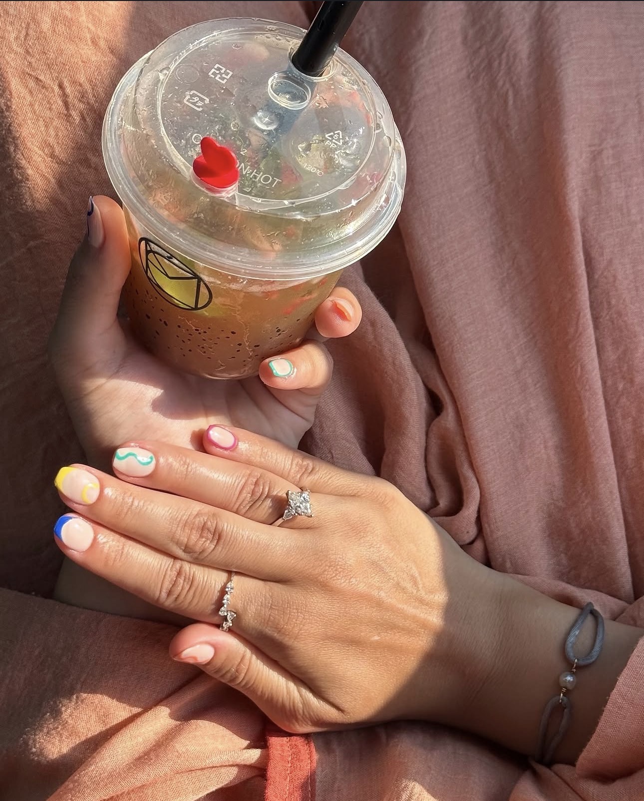 Colourful nail art and café drink at Mélo Beauty Lounge